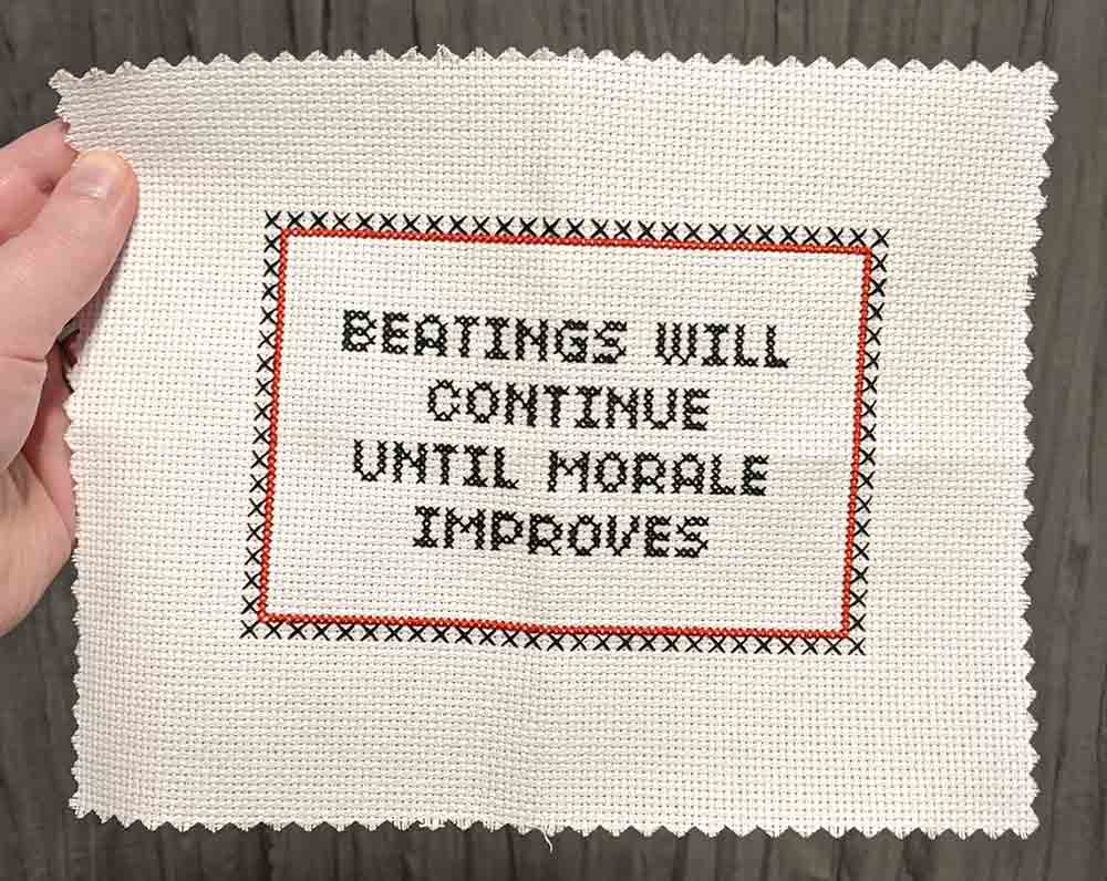 Cross stitch sampler of Beatings will continue until morale improves.