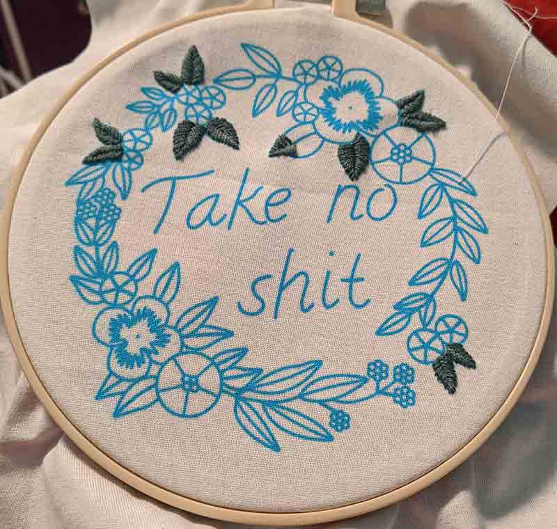 Take no shit in a floral wreath. 11 leaves are completed.